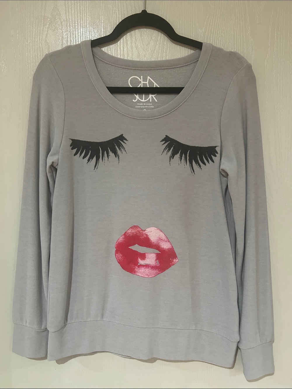 Chaser Gray Pullover Sweatshirt with Black Lashes and Pink Lips